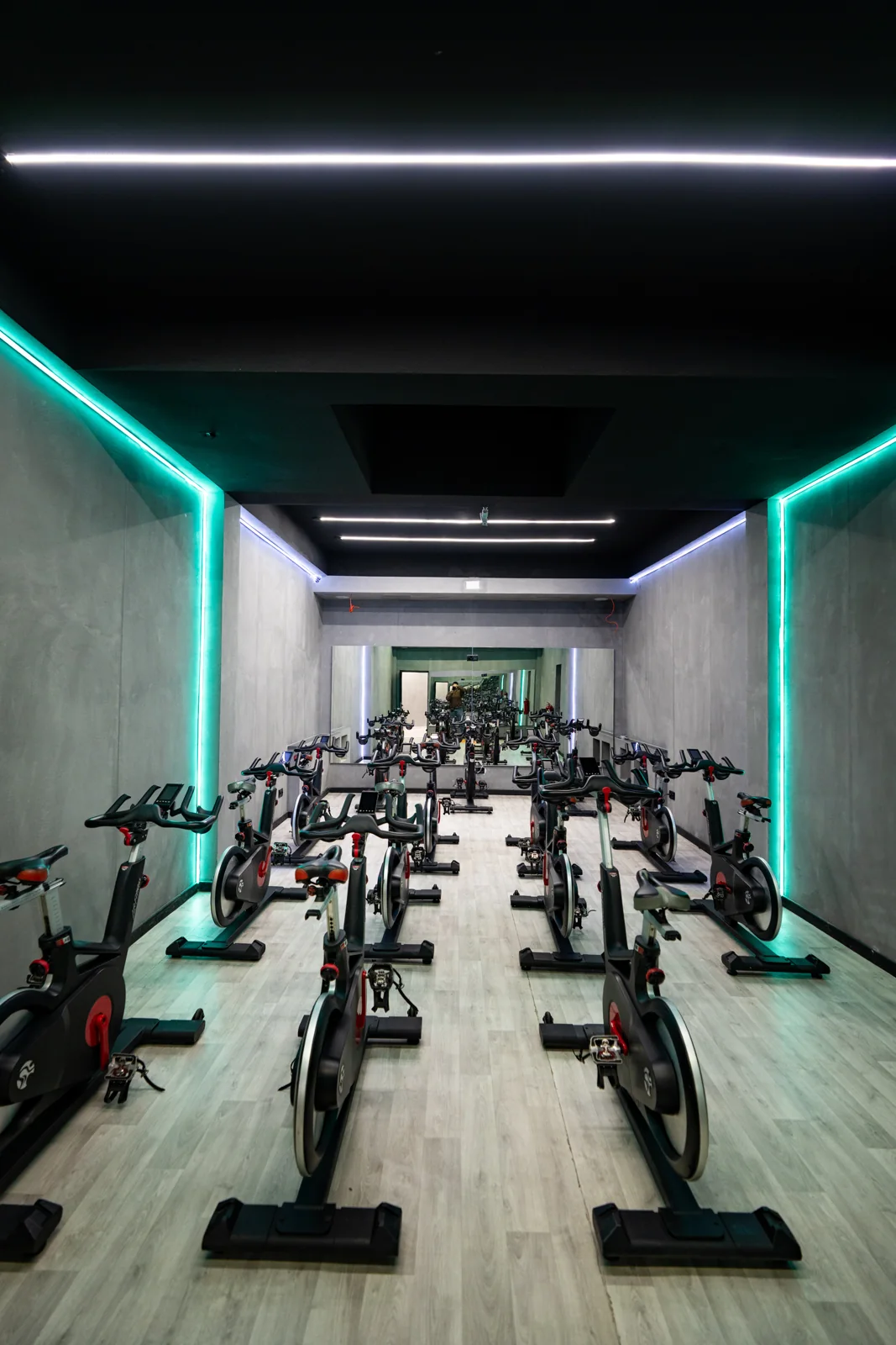 Rows of indoor cycling bikes